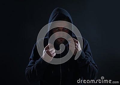 Mysterious man in hoodie. Dangerous criminal Stock Photo