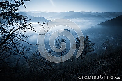 Mysterious misty morning over Biertan village, Transylvania, Romania Stock Photo