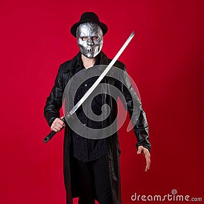 A mysterious ninja assassin in a noir style. A man in black clothes Stock Photo