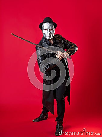 A mysterious ninja assassin in a noir style. A man in black clothes Stock Photo