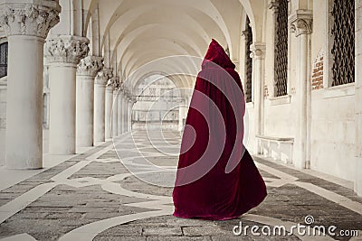 Mysterious person walking in old palace Stock Photo