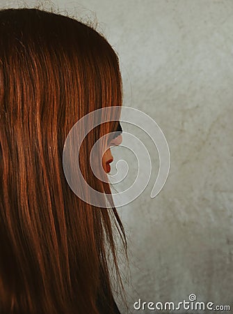 Mysterious red-haired girl in a mask Stock Photo