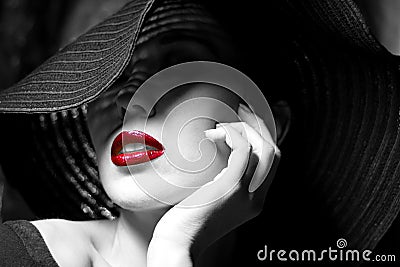 Mysterious woman in black hat. Red lips Stock Photo