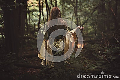 Mysterious woman in fairy forest Stock Photo