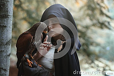 Mysterious woman with hawk Stock Photo