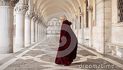 Mysterious woman in red cloak Stock Photo
