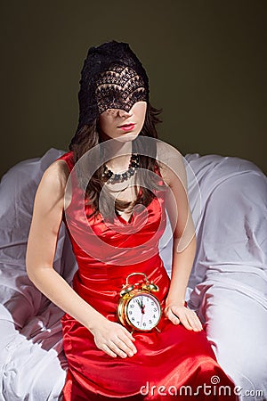 Mysterious young lady in black mask waiting with Stock Photo