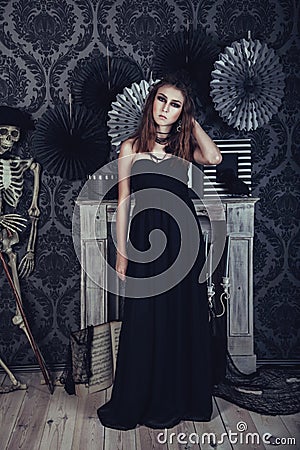 Mysterious young woman in black dress Stock Photo