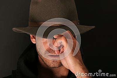 Mystery man with hat Stock Photo