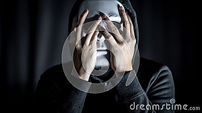 Mystery man wearing white mask Stock Photo