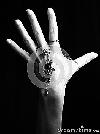 Mystic black & white female hand with gothic chain Stock Photo