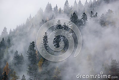 Mystic cloudy and foggy autumn alpine mountain slopes scene. Austrian Lienzer Dolomiten Alps Stock Photo