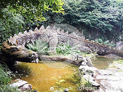 Mystic dragon in a pond Stock Photo