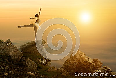 Mystic pictures, ballet dancer stands on the cliff edge Stock Photo