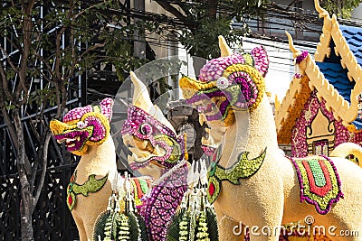 Mystical creatures on a floral float Stock Photo