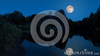 A mystical full moon night on the Externsteine Stock Photo