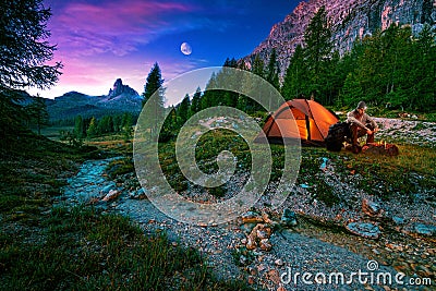 Mystical night landscape, in the foreground hike, campfire and tent Stock Photo