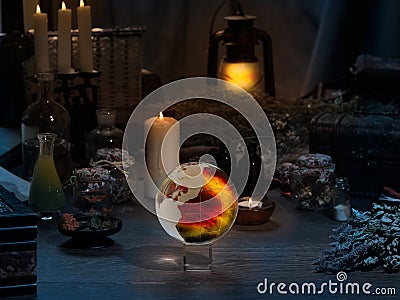 Mystical still-life. Magic ball, dry herbs, all for magical rituals. A lot of items Stock Photo