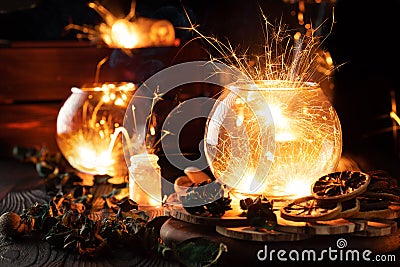 Mystical still life, sparks caught in glass vessels Stock Photo