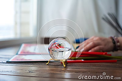 Mysticism in everyday life. Esoteric in a magic ball close-up and copy space. Fortune telling on the ball Stock Photo