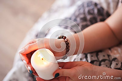 Mysticism in everyday life. Esoteric in a magic candle close-up and copy space. Fortune telling by a candle. Stock Photo