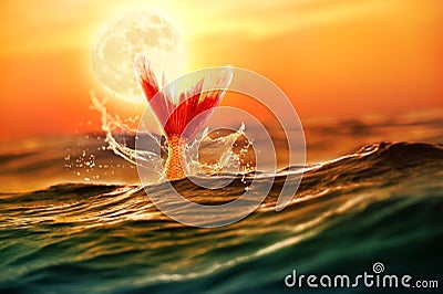 Mythical mermaid diving in the deep ocean Stock Photo