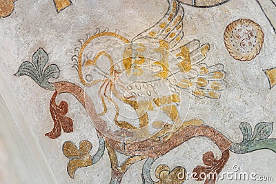 The mythological bird Phoenix feeding his nestlings with his own blod, an ancient mural Editorial Stock Photo