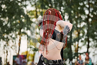 Mythological dancing girl faun on green lawn in public park outdoor art dancing event Stock Photo