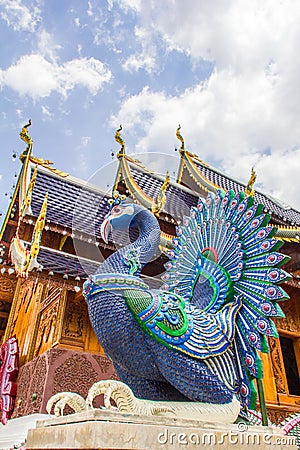 mythological peacocks guarding the buddhist church, ban den sally see monk can temple, chiang mai Stock Photo