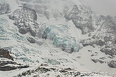 MÃ¶nch north wall and Eigergletscher train station. Grindelwald Stock Photo