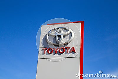 Close up of column with isolated logo of Toyota car manufacturer against blue sky Editorial Stock Photo