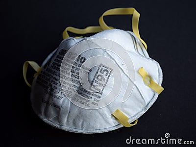 N95 mask in dramatic lighting Editorial Stock Photo