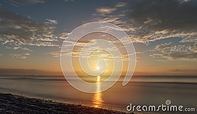 NÄƒvodari Beach - the sun that sets into the sea Stock Photo