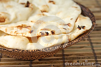 Naan Bread in Wooden Bowl Stock Photo