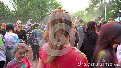 Naberezhnye Chelny, Russia - May 24, 2023 : Holi festival of colors, young people, guys and girls celebrate the beginning of stock video footage Naberezhnye Chelny, Russia - May 24, 2023 : Holi festival of colors, young people, guys and girls celebrate the beginning of stock video footage