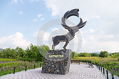 NACHIKI, KAMCHATKA PENINSULA, RUSSIA - AUGUST 07, 2018: Sculpture of a deer at the entrance to the village. Editorial Stock Photo