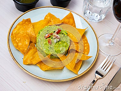 Nachos con guacamole. Corn chips. Stock Photo