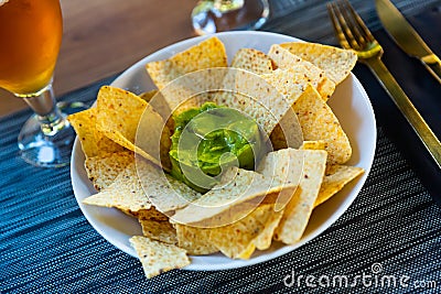 Nachos con guacamole. Corn chips. Stock Photo