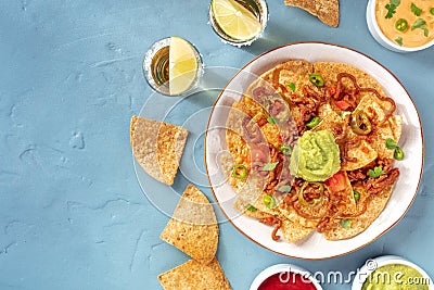 Nachos plate with tequila shots and a place for text Stock Photo