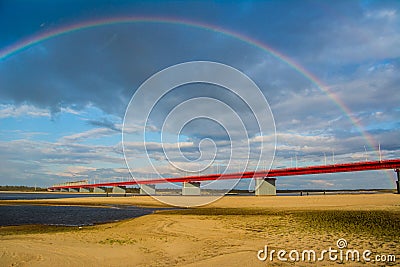 Nadym bridge and rainbow Stock Photo