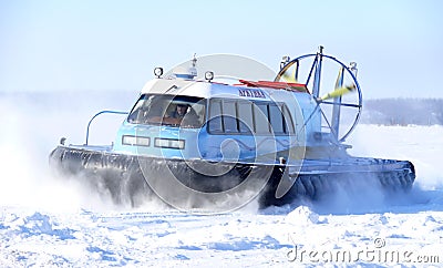 Nadym, Russia - March 15, 2008: the Soviet snowmobile Arctic goes on snow. Editorial Stock Photo