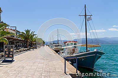 Greece, Nafplio, Old Town, Restaurants on the seawall along the sea Editorial Stock Photo