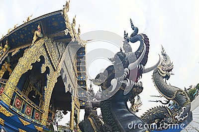The Naga Ladder Sculpture front of chapel at Wat Rong Suea Ten temple. Editorial Stock Photo