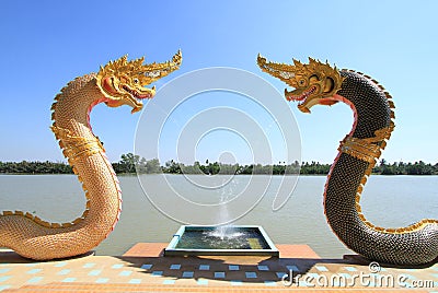 Naga statue by the river Stock Photo