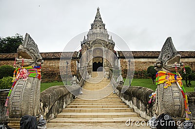 Naga statues staircase at front of gate entrane of Wat Phra That Lampang Luang Stock Photo