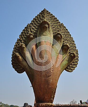 Naga stone statue in front of famous Angkor Wat temple complex, Stock Photo