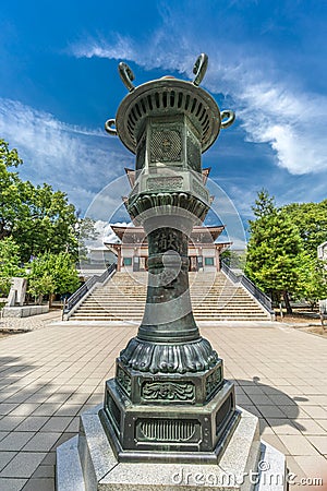 Bronze Lantern (Tourou) in front of Nihon Chureiden Shrine, the war memorial pagoda at Zenko-ji temple Editorial Stock Photo