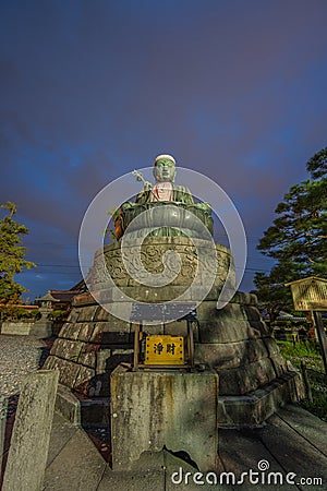 Nure Botoke (Wet Jizo) Bodhisattva Seated bronze statue of Jizo-Bosatsu protects the temple from fire, Zenko-ji Temple complex in Stock Photo
