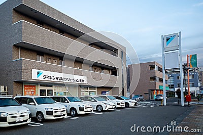 Nagano, Japan - 2 November 2023 : Front facade of a Daikin service center store with parking lot at Nagano city, Japan Editorial Stock Photo