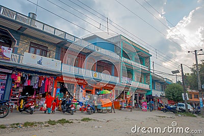 NAGARKOT, NEPAL OCTOBER 04, 2017: Beautiful view of dowtown with unidentified people walking in a sandy roads in the Editorial Stock Photo